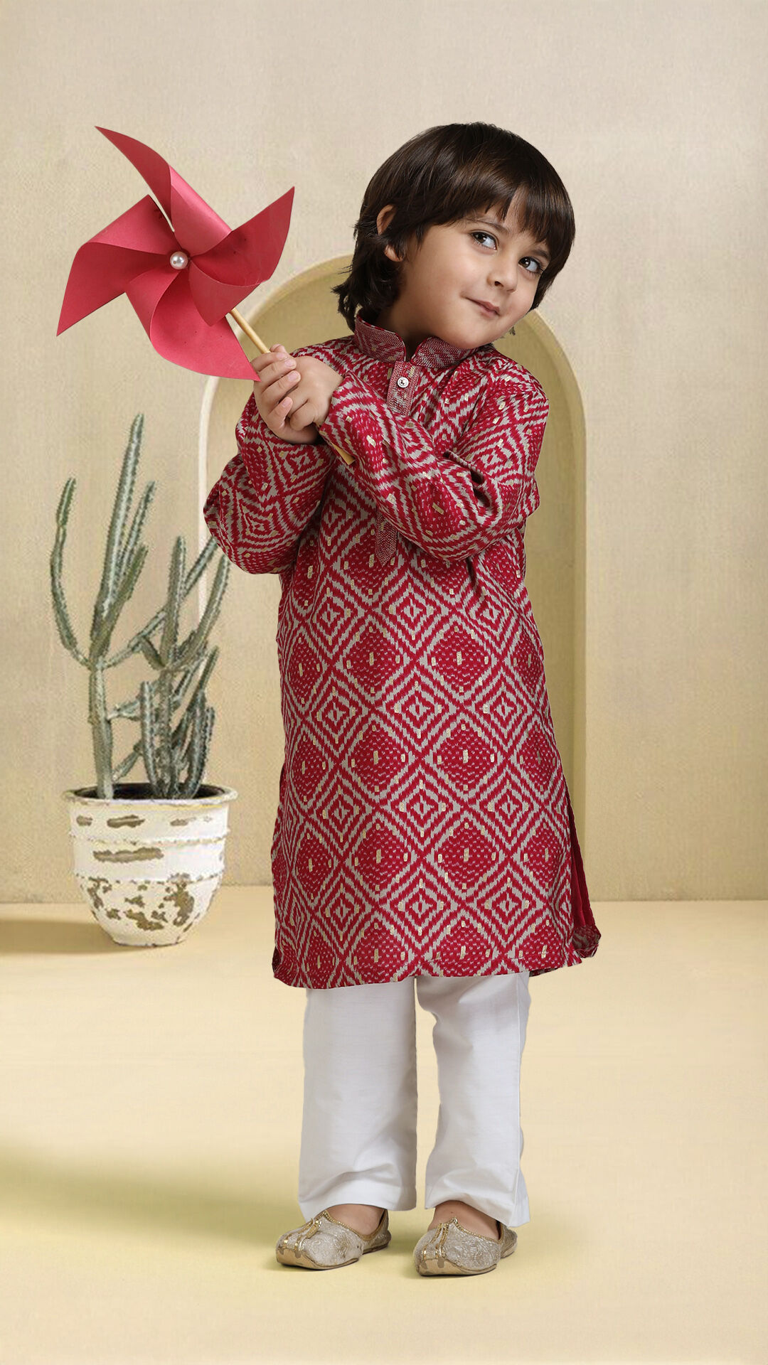 Boy wearing an red kurta pajama